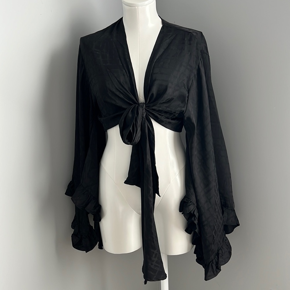 Hot and Delicious. Going out flounce sleeve wrap top. New without tags.